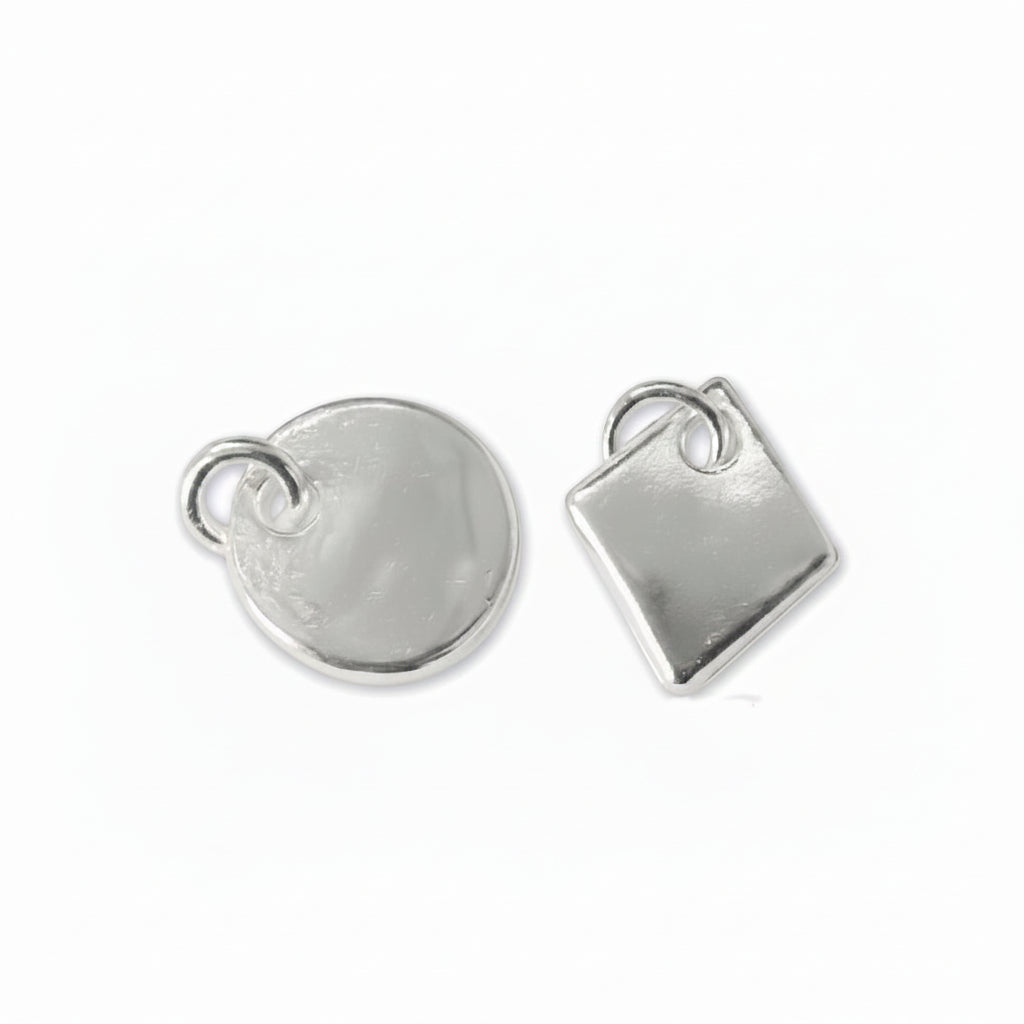 Two silver metal jewelry charms, one round disc and one square, each with a small loop at the top, shown on a plain white background.