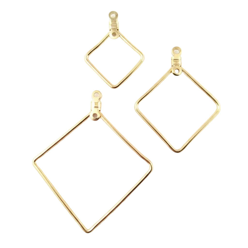 Three gold-toned wire hoop earrings with diamond-shaped frames and lobster clasp closures, arranged on a textured light gray background.