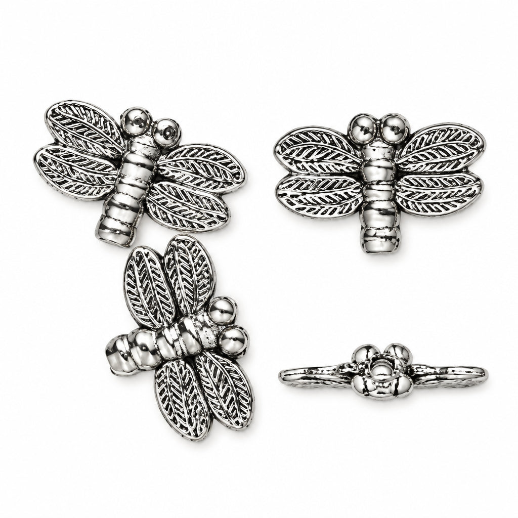 Three views of a silver dragonfly jewelry charm with textured wings, shown on a plain white background.