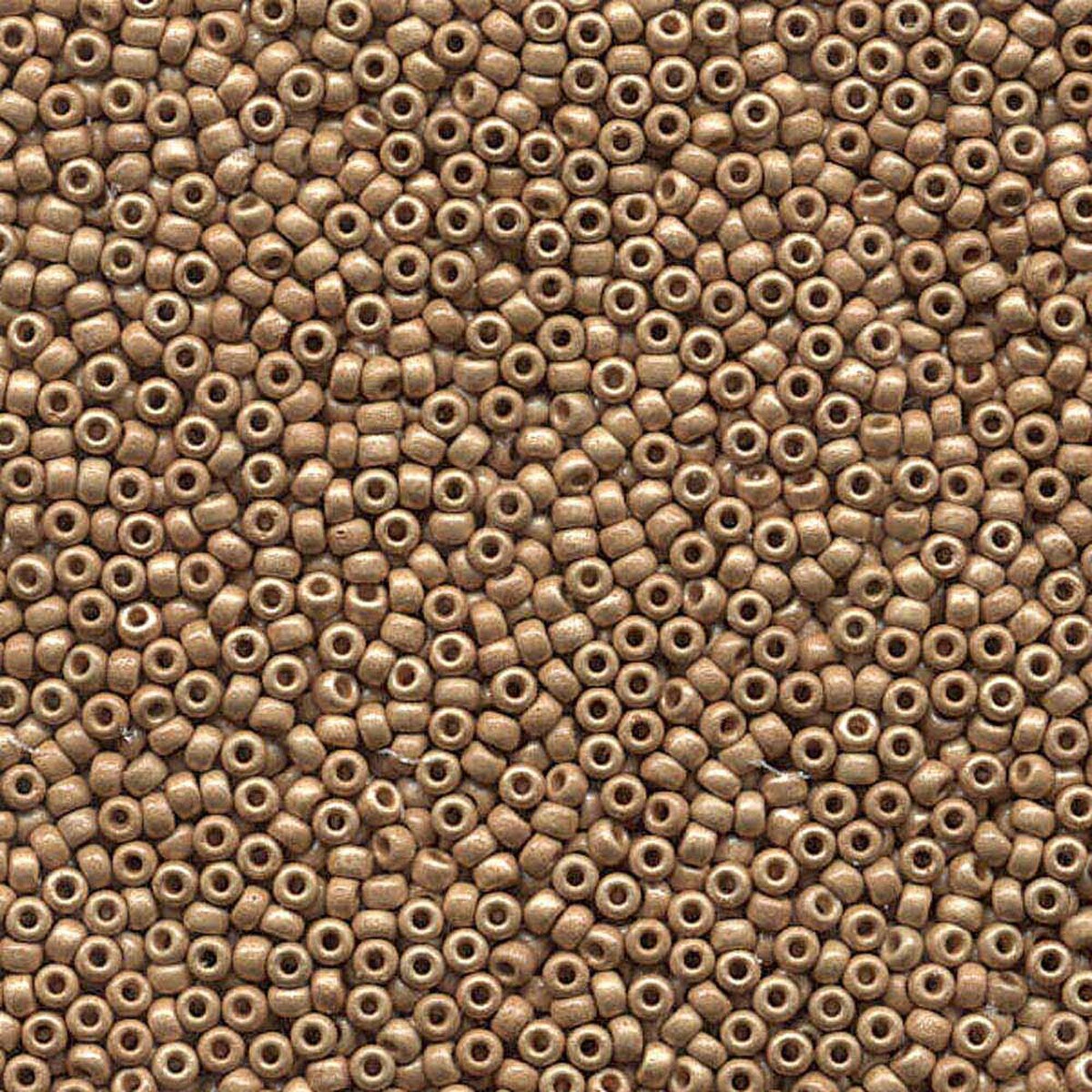 A dense, close-up pile of small metallic bronze cylindrical beads with central holes, filling the entire frame.