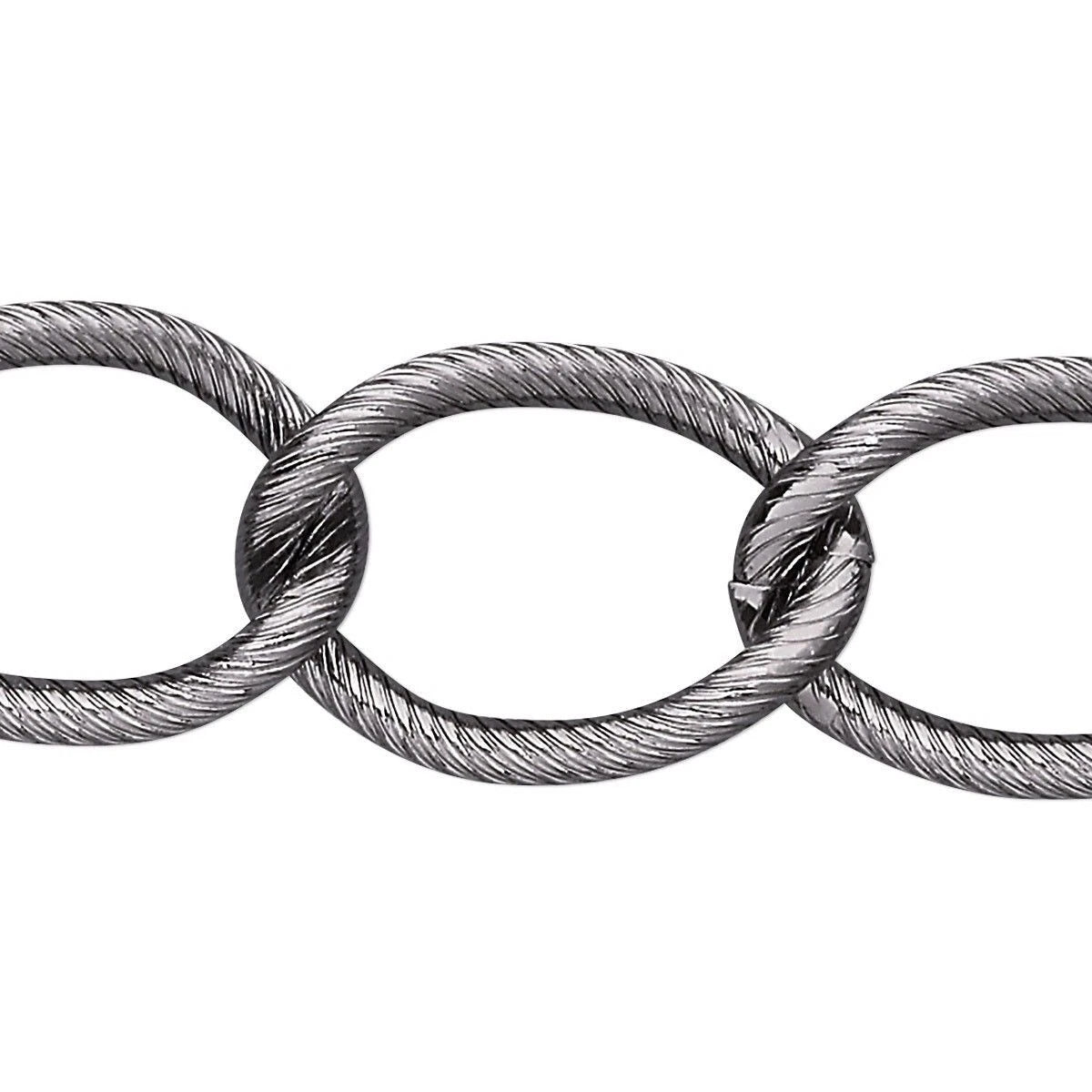 A close-up of a metallic cable chain link, showing the textured, twisted steel wire construction of interlocking oval links on a plain white background.