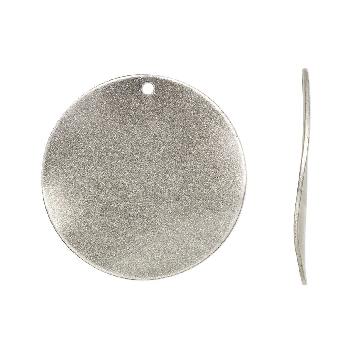 A silver-toned round metal disc pendant with a small hole at the top, shown from the front and side on a plain white background.