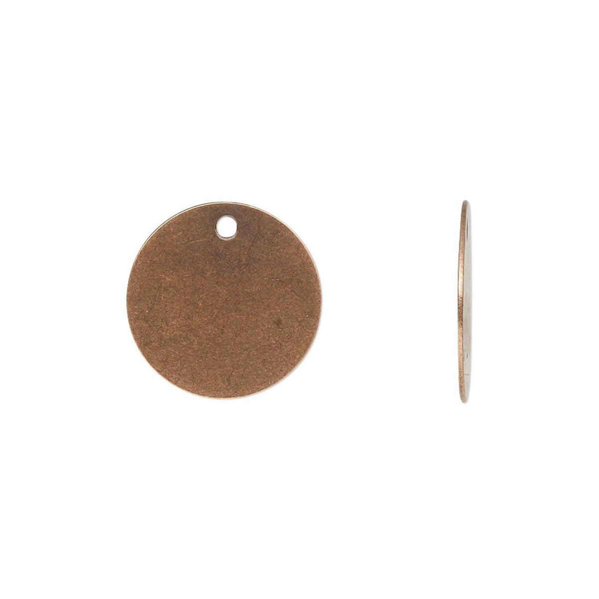 Two round copper-colored metal jewelry findings on a plain white background, one shown from the front with a small hole and one from the side.
