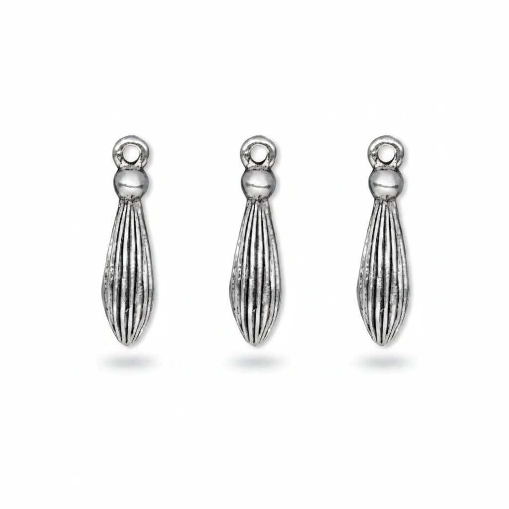 A small silver-toned metal charm with a textured, ribbed teardrop shape and a loop at the top, shown on a plain white background.