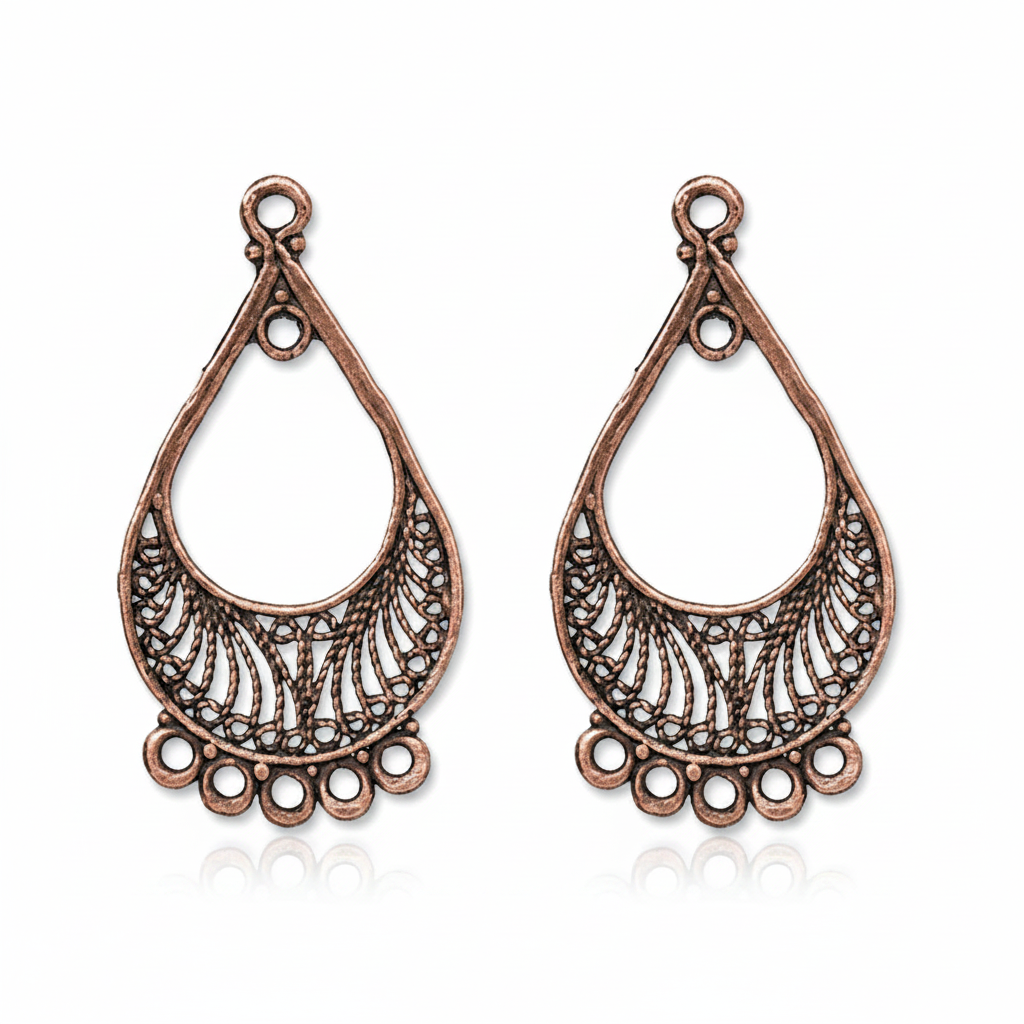A pair of antique bronze teardrop-shaped filigree jewelry charms on a solid white background.