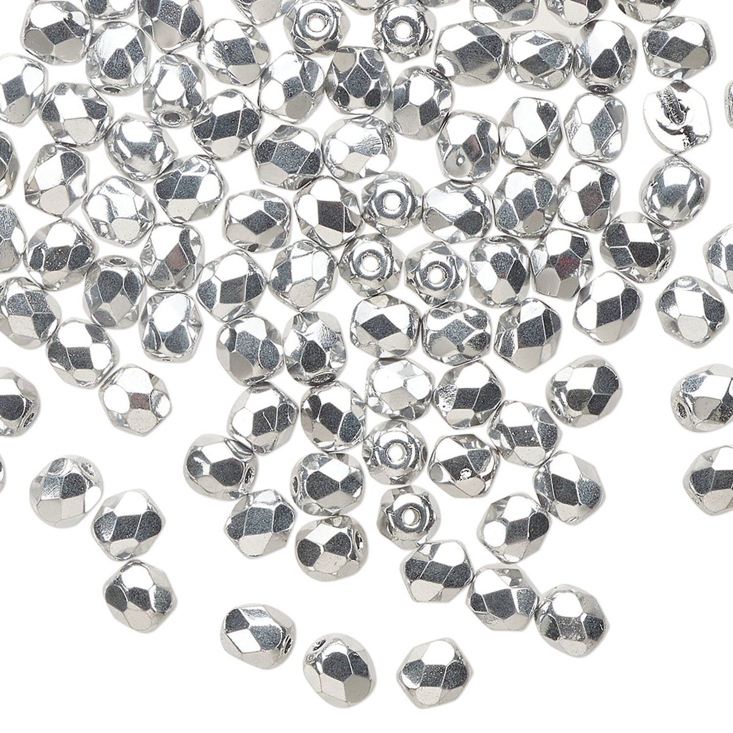 A pile of small silver faceted beads scattered on a plain white background.