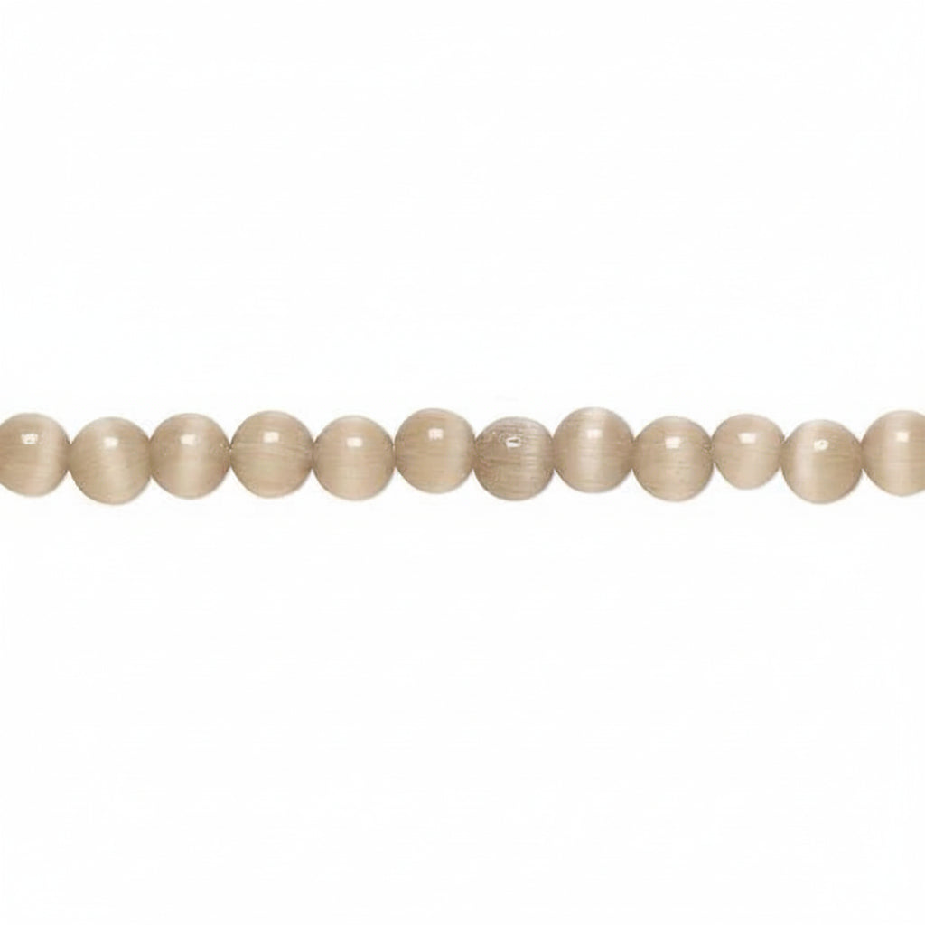 A strand of smooth, polished round beads in a light beige or cream color, arranged horizontally against a plain white background.