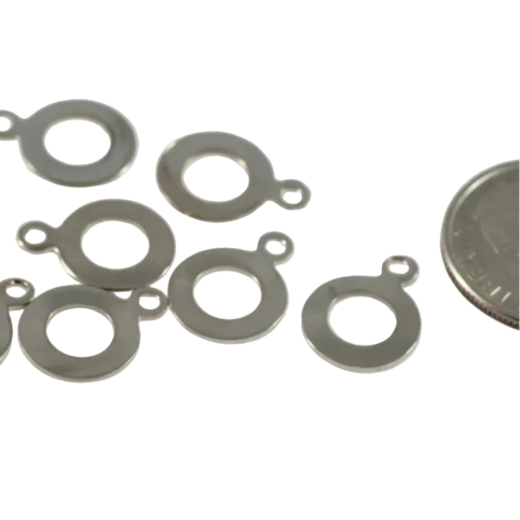 Ten small silver metal ring jump rings with attachment loops, displayed on a white background with a millimeter ruler at the bottom for scale and a coin on the right for size reference.