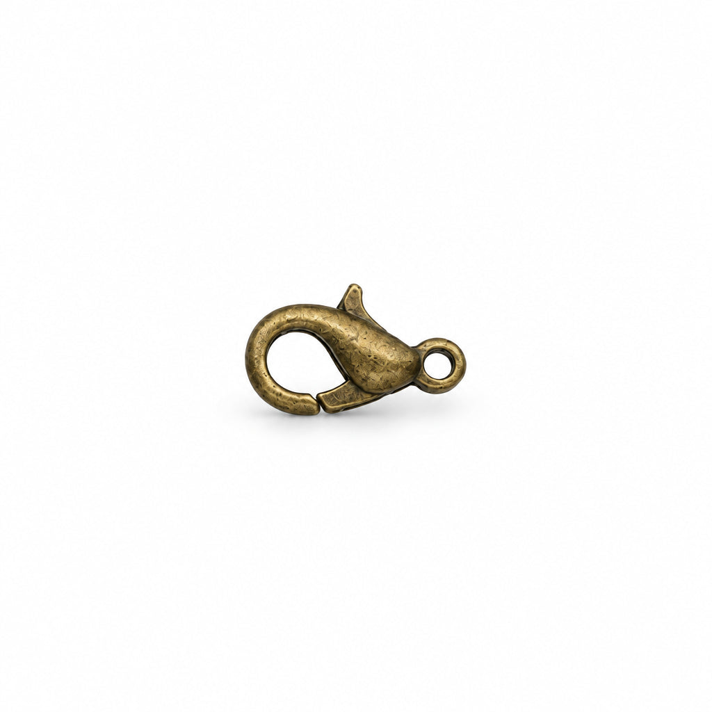 A single small lobster clasp jewelry finding with an antique brass finish, centered on a solid white background.