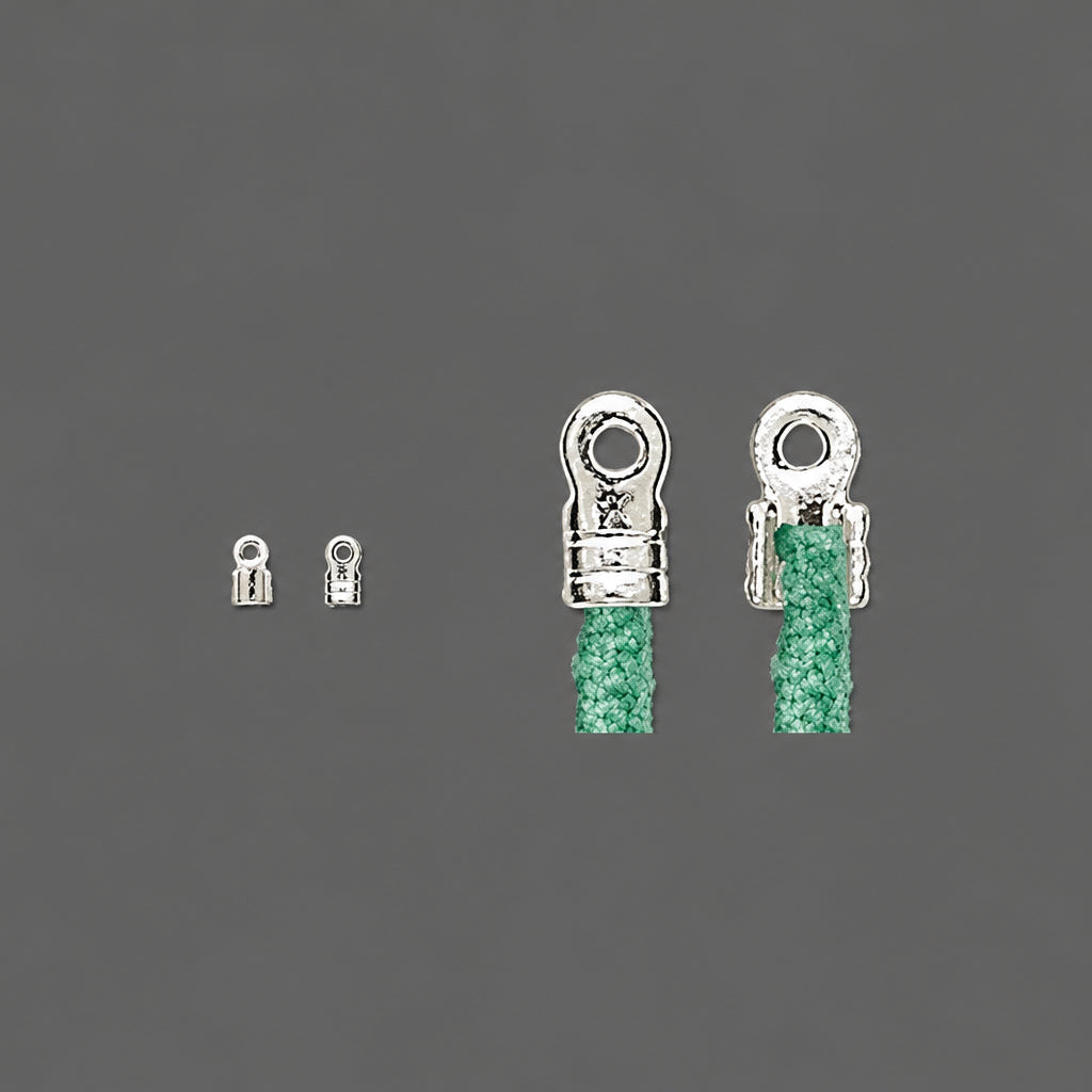 Two silver-toned metal lobster claw clasps shown on a dark gray background, with green braided cord threaded through the larger clasps.