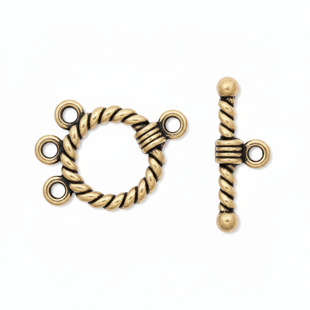 A pair of antique gold-toned rope toggle clasp jewelry findings on a plain white background, showing both the front of the ring and the side profile of the toggle bar.
