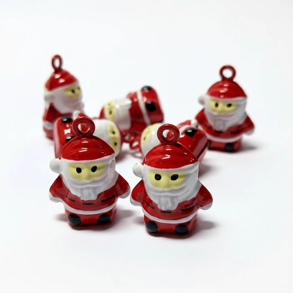 Several small Santa Claus figurines in red and white, each with a hanging loop at the top, arranged on a plain white background.
