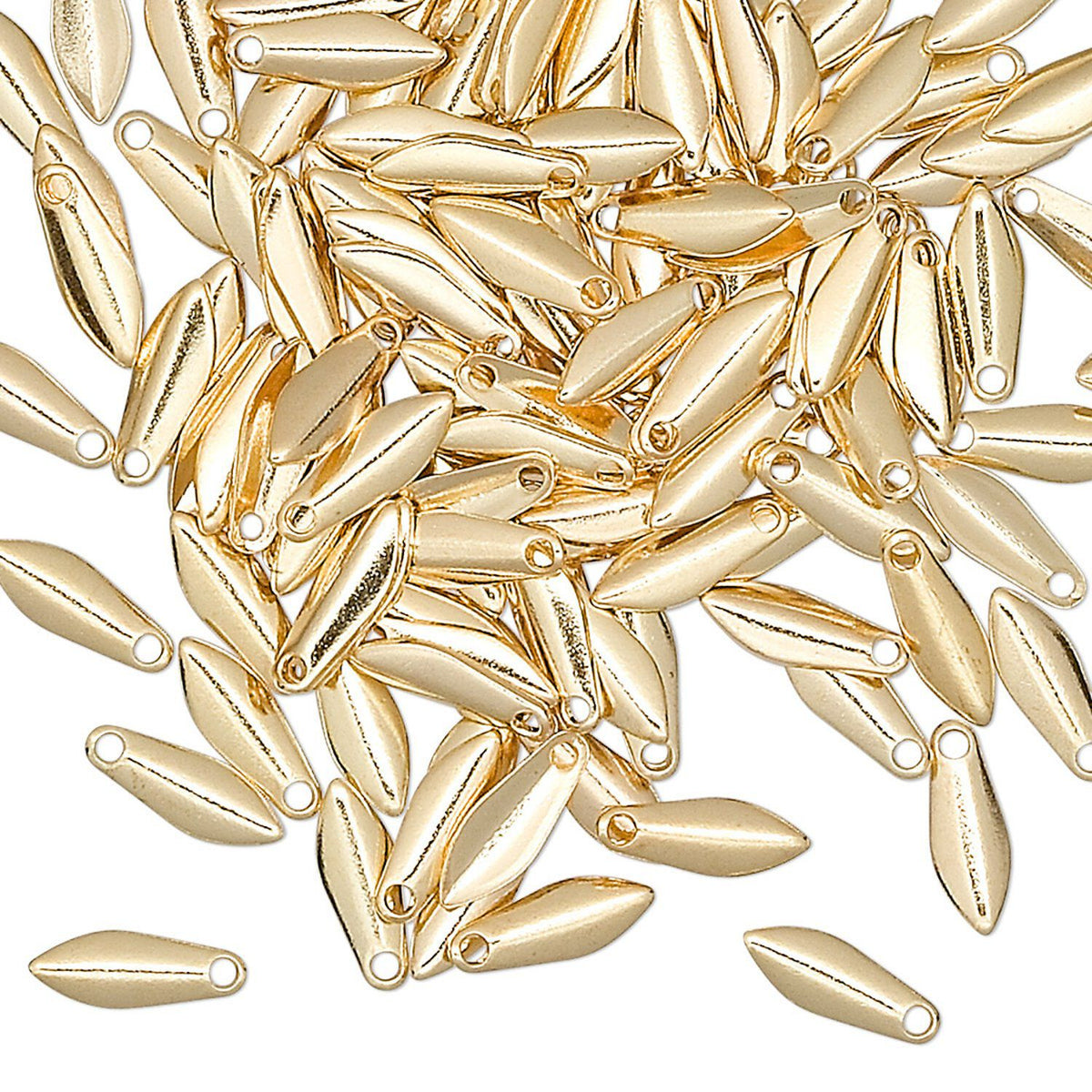 A pile of small metallic gold teardrop-shaped beads with oval eyelets, scattered on a plain white background.