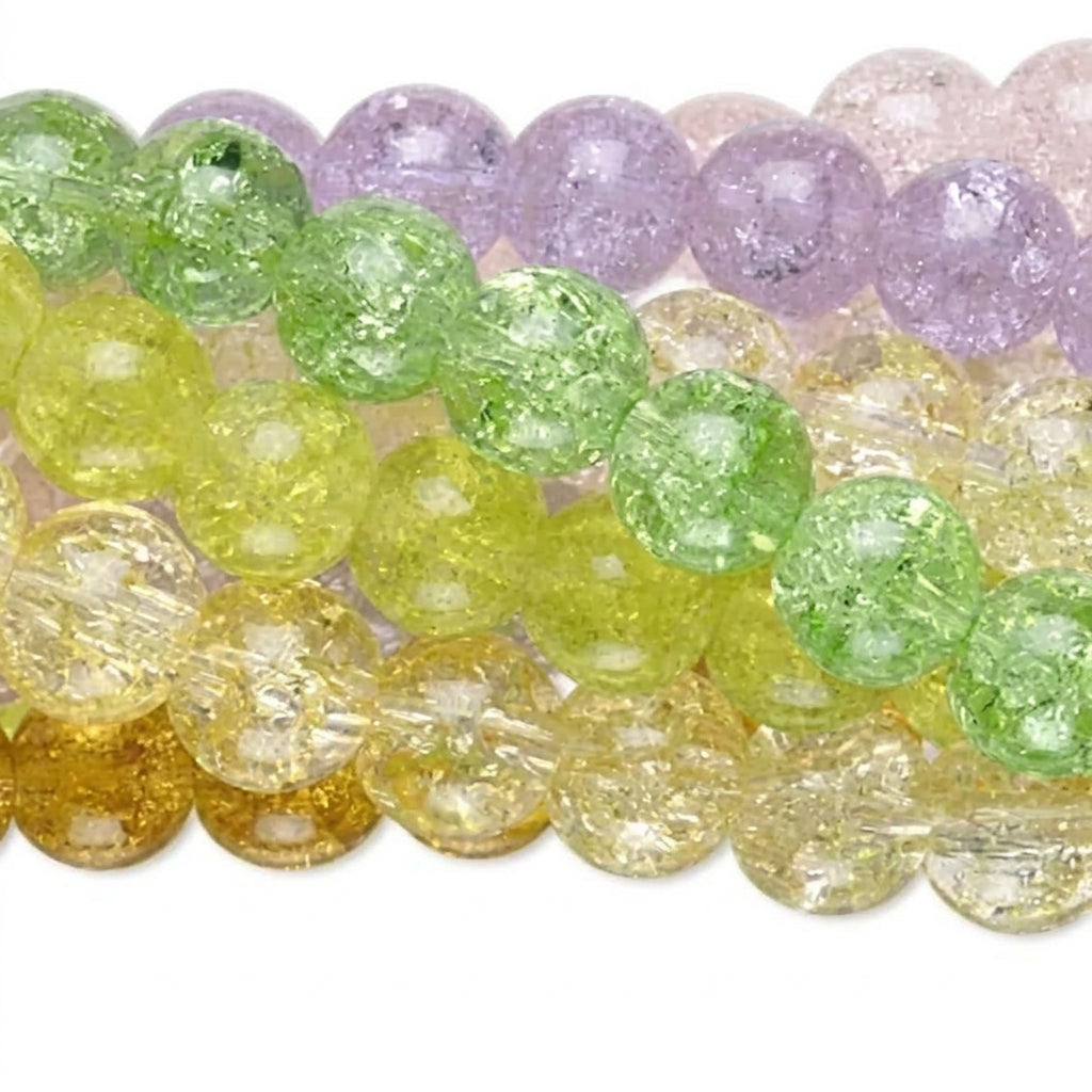 strands of round, textured glass beads in pastel colors: lavender purple, light green, and pale yellow, arranged horizontally on a white background.