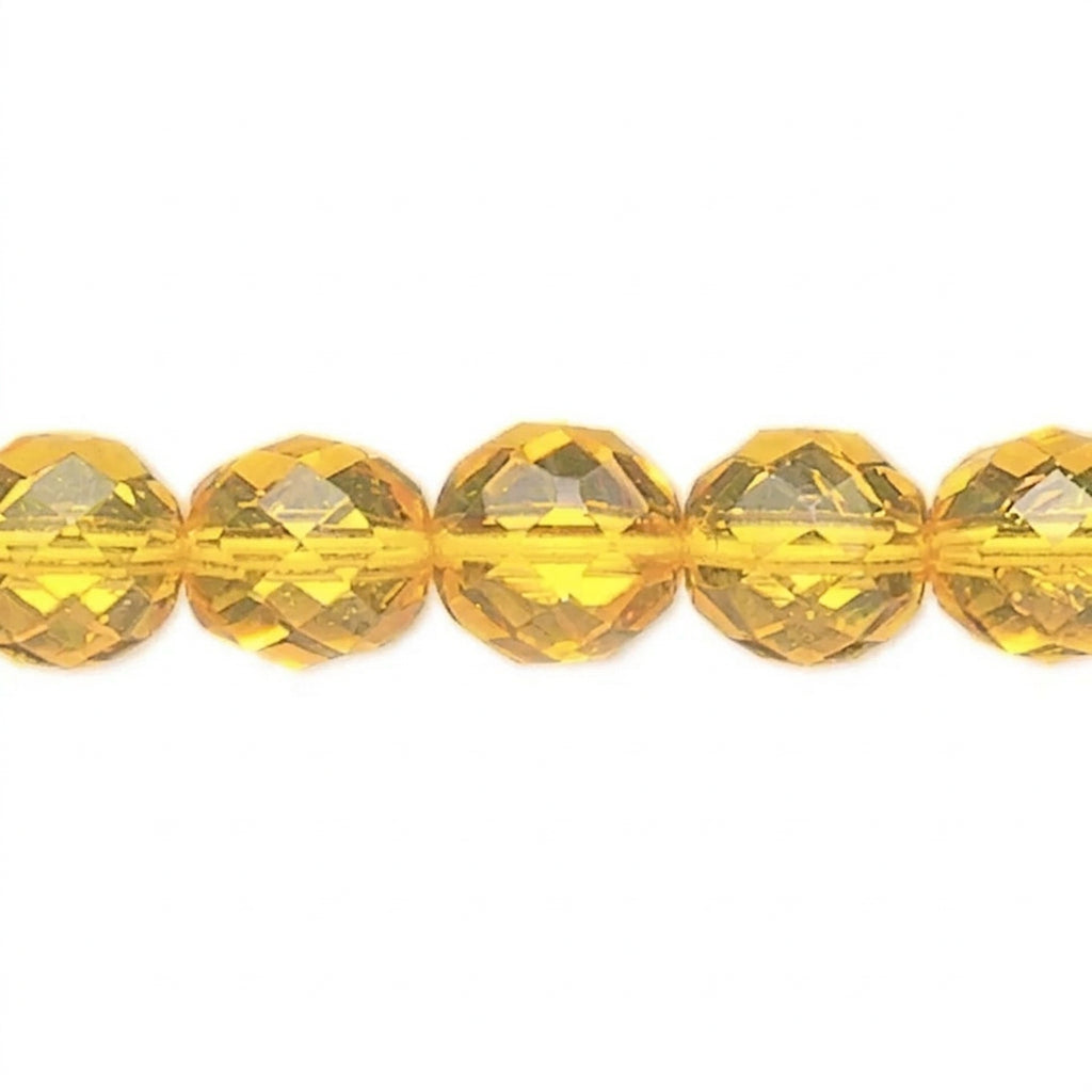 Faceted round yellow gemstone beads strung on a thin cord, shown against a plain white background.