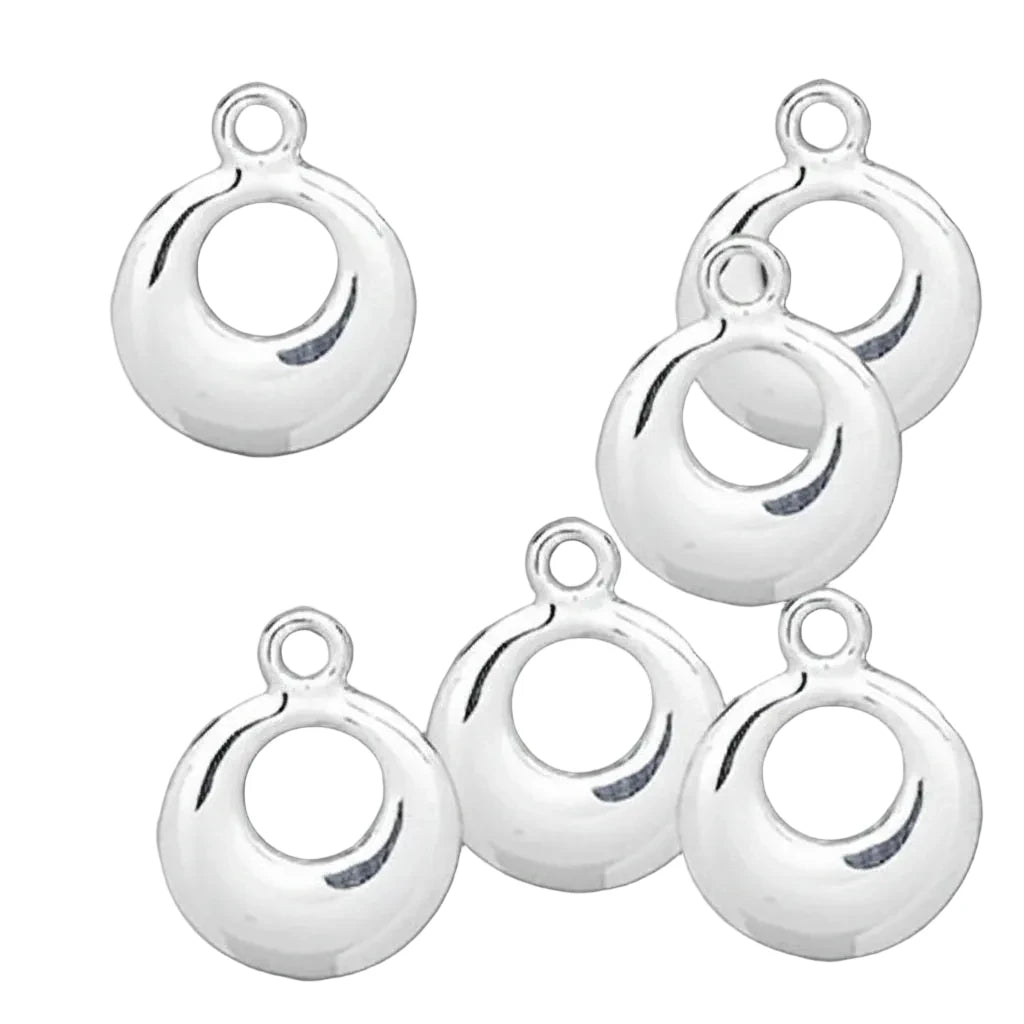 Five polished silver crescent-shaped jewelry findings with top loops, arranged on a solid dark gray background.