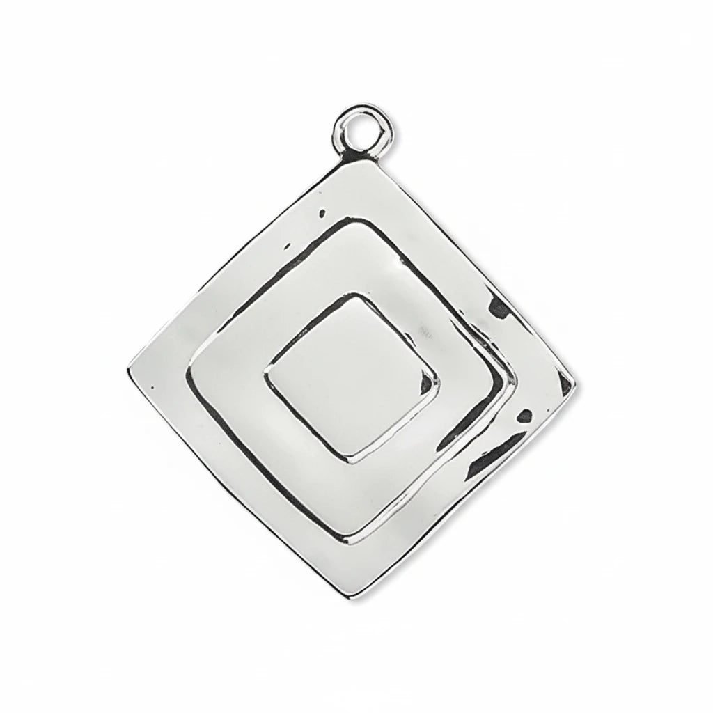 A silver geometric pendant charm with concentric square designs and a top loop, shown on a plain white background.