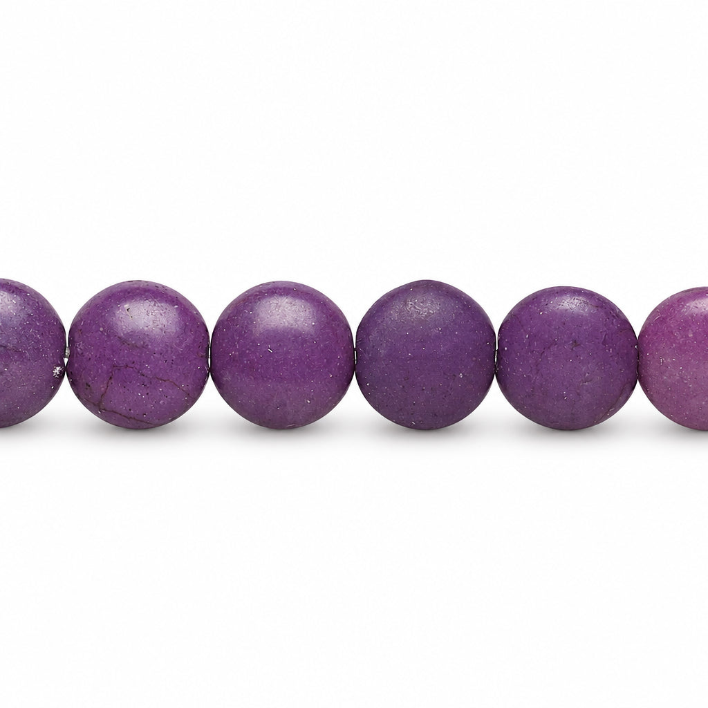 A close-up of a strand of smooth, matte purple beads on a plain white background.