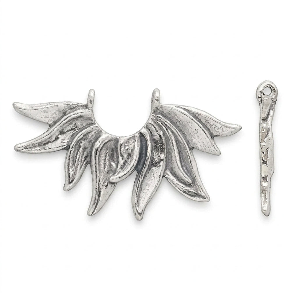 A silver crescent moon pendant with leaf-like rays, shown alongside a matching vertical silver bar on a solid dark gray background.