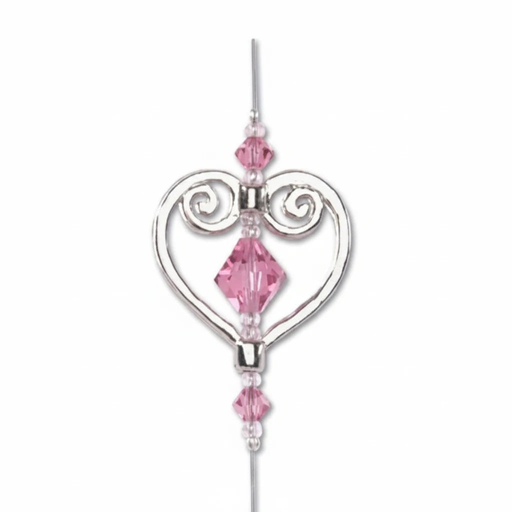 A silver-toned heart-shaped hanging ornament with pink faceted crystal beads, shown on a plain white background with a black 'SAMPLE USE NOT INCLUDED' text overlay at the bottom.