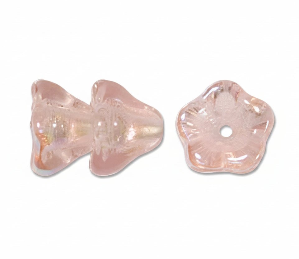 Two small iridescent glass beads on a plain white background, one butterfly-shaped and one flower-shaped with a center hole.