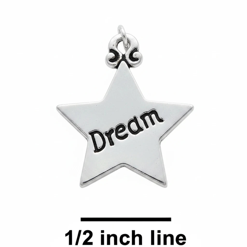 A silver star-shaped charm engraved with the word 'Dream' in black, shown on a textured blue background with a size reference label '1/2 inch line' below.