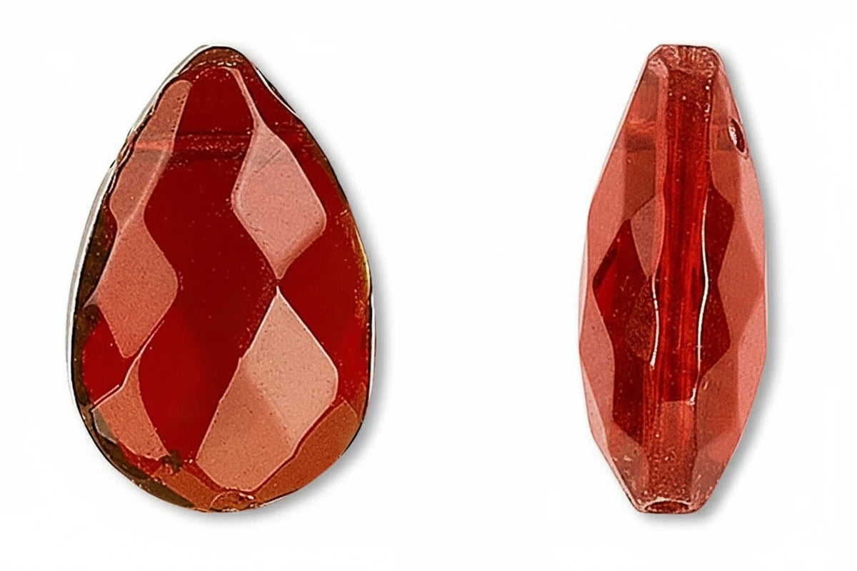 Two red faceted beads on a white background