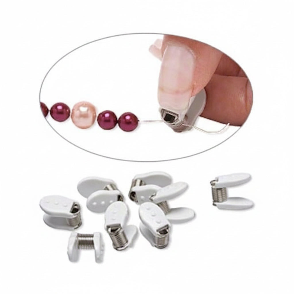 Set of white hair clips with a close-up of a hand using one, surrounded by pink and red beads.