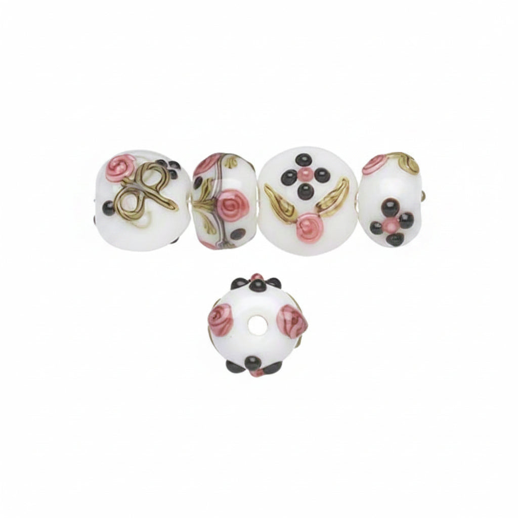 Set of decorative beads with floral and designs on a white background