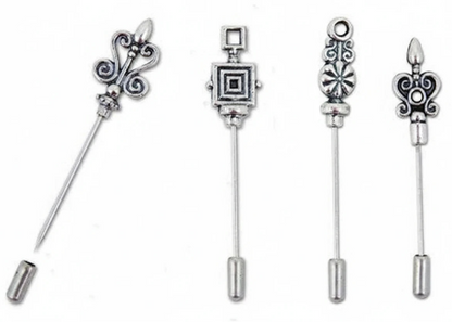Four silver-toned decorative safety pin backings with ornate filigree and geometric designs, displayed on a plain white background.