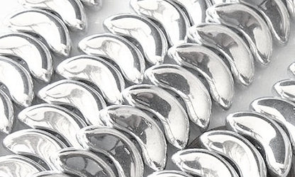 Close-up of silver metallic wing-shaped beads.