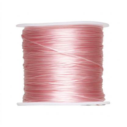 A spool of light pink elastic cord or thread wound tightly on a white plastic core, shown against a plain white background.
