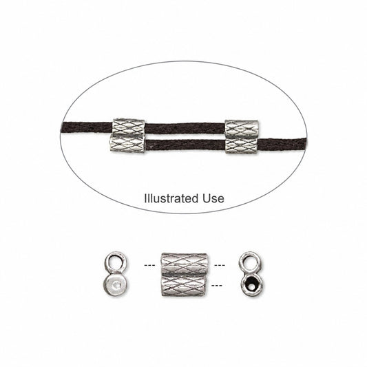 A silver-toned textured  bead shown on a black cord, with an oval labeled 'Illustrated Use' and smaller side views below showing how it fits on both ends.