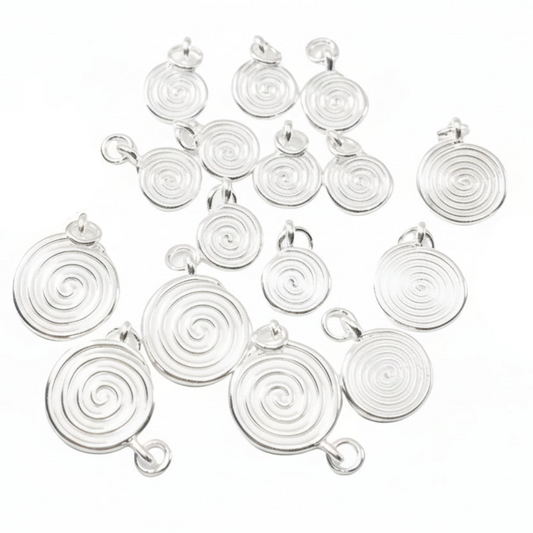 Multiple silver spiral pendant charms arranged on a white background, 