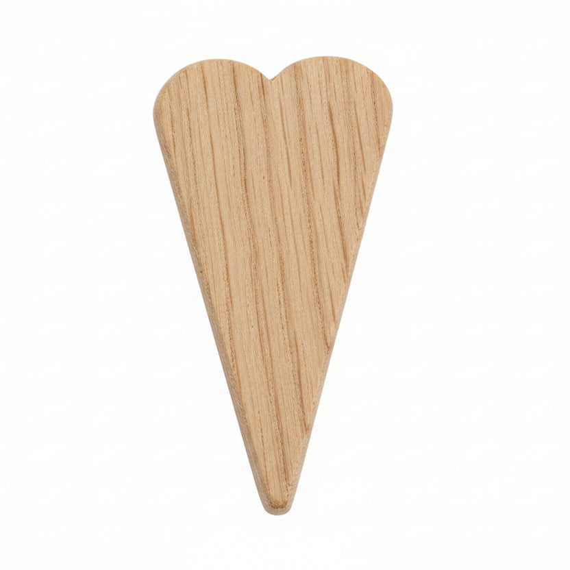 A single light natural wood heart-shaped pick or pin with visible wood grain, centered on a plain white background.