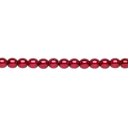 A single strand of glossy, metallic deep red round beads laid horizontally against a plain white background.