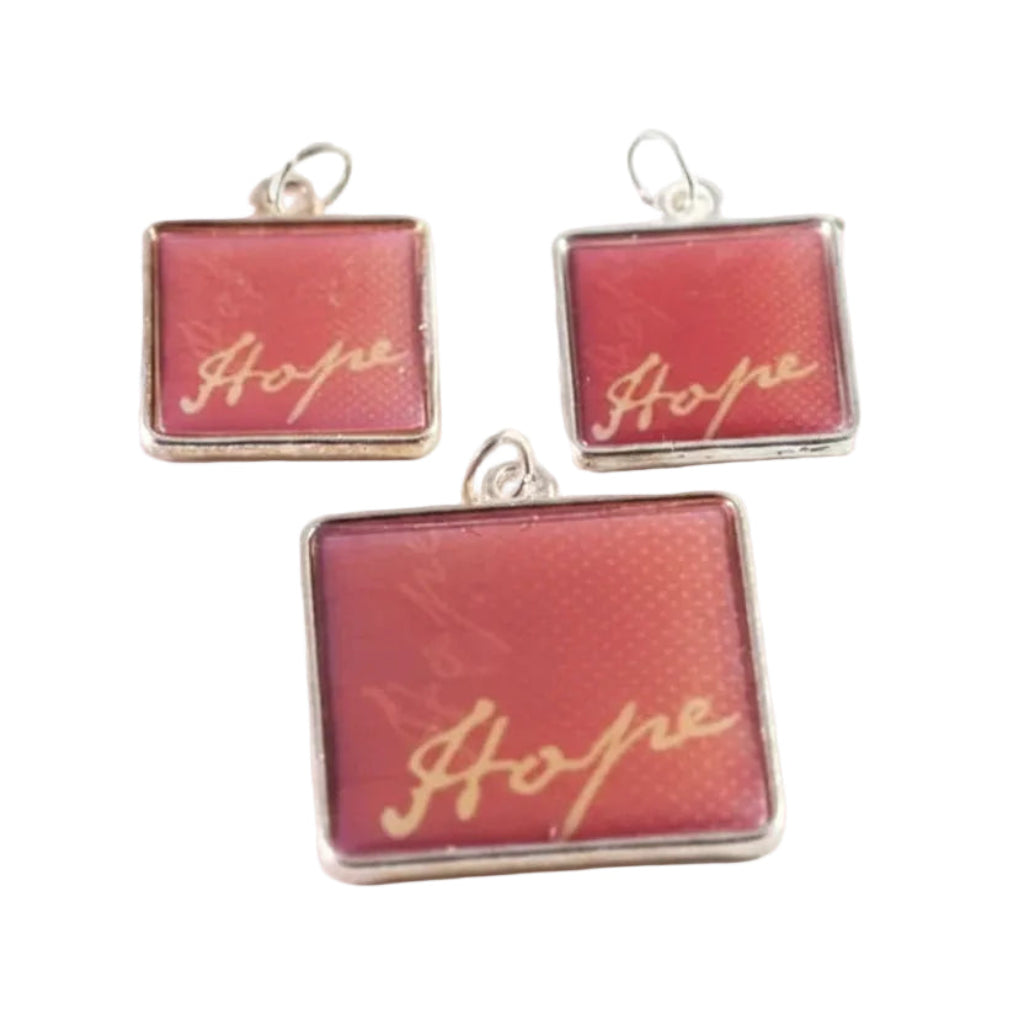 Three square jewelry charms with silver borders and loops, featuring a textured red background with the word 'Hope' written in gold cursive script.