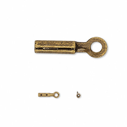 An antique bronze metal ring terminal with a split contact slot, shown in a close-up oval inset above a smaller full view and a small hardware piece on a white background.