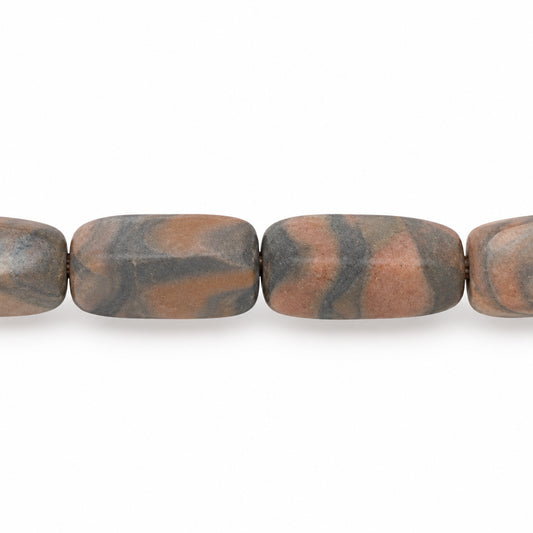 A close-up of a beaded strand featuring elongated, rounded rectangular beads with a natural marbled pattern in earthy brown, black, and tan.