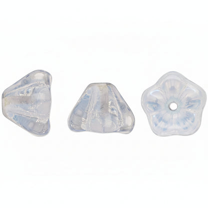 Three small translucent decorative beads or cabochons on a plain white background: one irregular triangle, one small triangle, and one five-petal flower shape with a center hole.