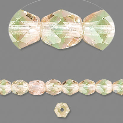 Faceted glass beads in a pale peach-pink and light green iridescent finish, shown as a group, as a strand, and as a single loose bead on a dark gray background.