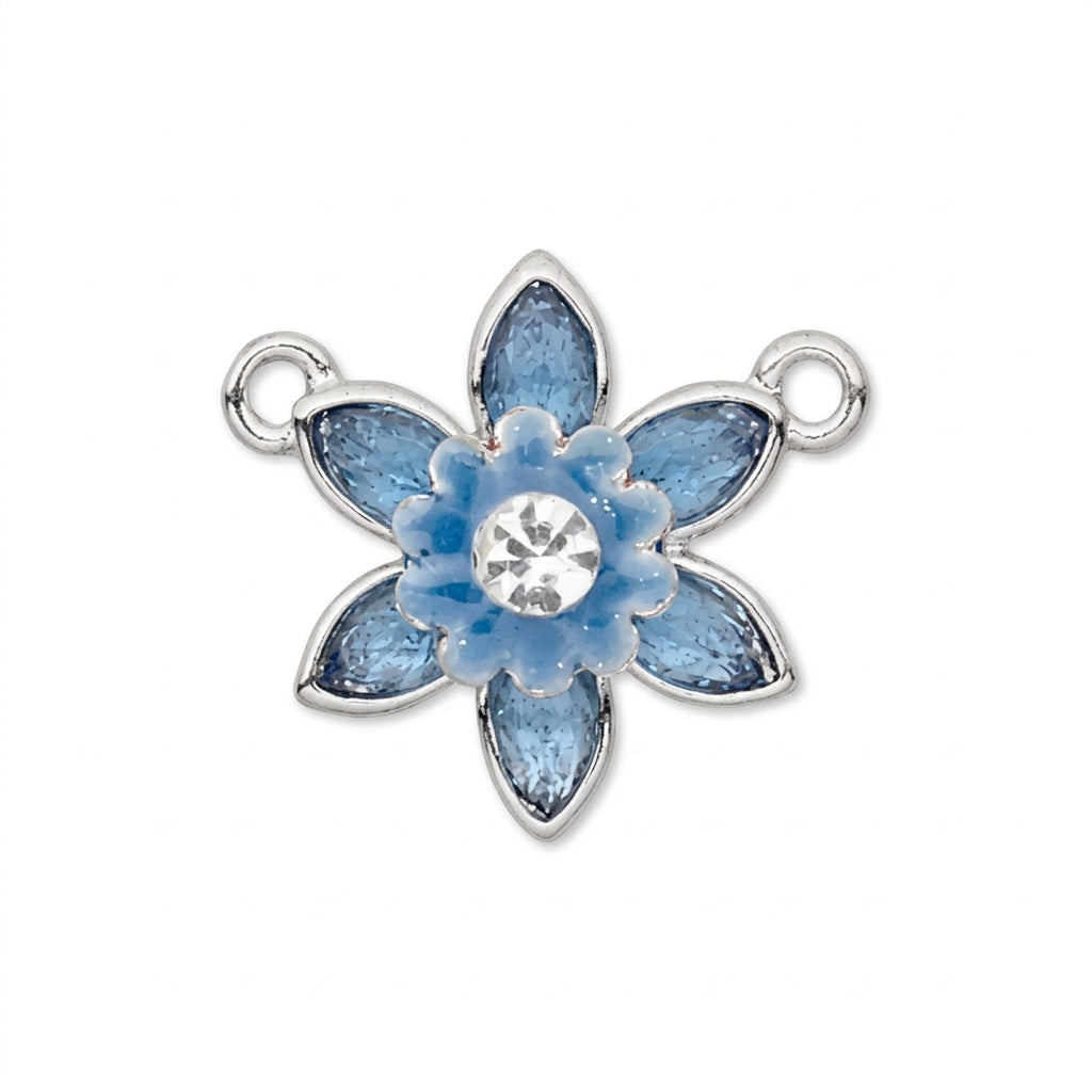 A silver-tone flower-shaped jewelry charm with light blue enamel petals and a clear rhinestone in the center, shown on a plain white background.