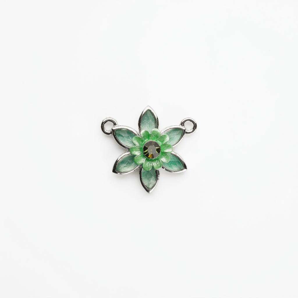 A silver-toned six-petal flower charm with light green enamel petals and a faceted dark gray center, shown on a plain white background.