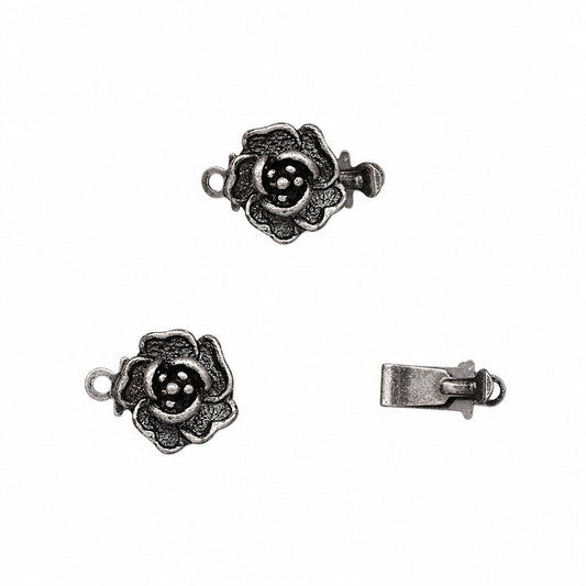 Three views of an antique silver rose-shaped clasp with a small hanging loop, shown on a plain white background.