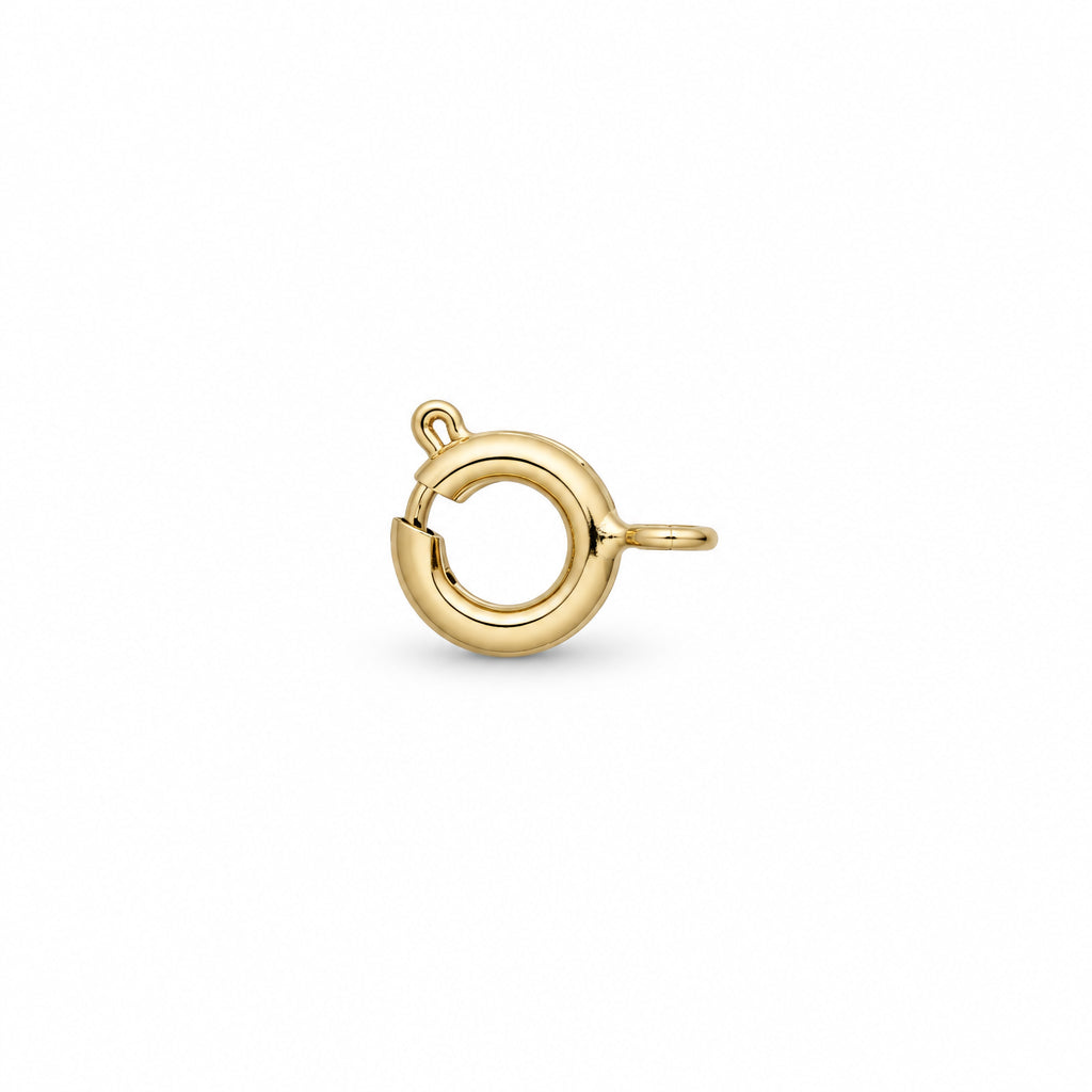 A gold metal jump ring clasp with a straight post and a dashed measurement guide indicating its width, set against a plain white background.