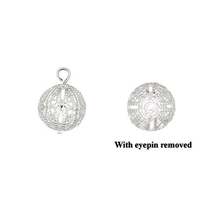 Two views of a silver filigree ball charm pendant on a white background, with one view showing a loop at the top and the other showing a cross-shaped cutout, with the text 'With eyepin removed' below the right view.