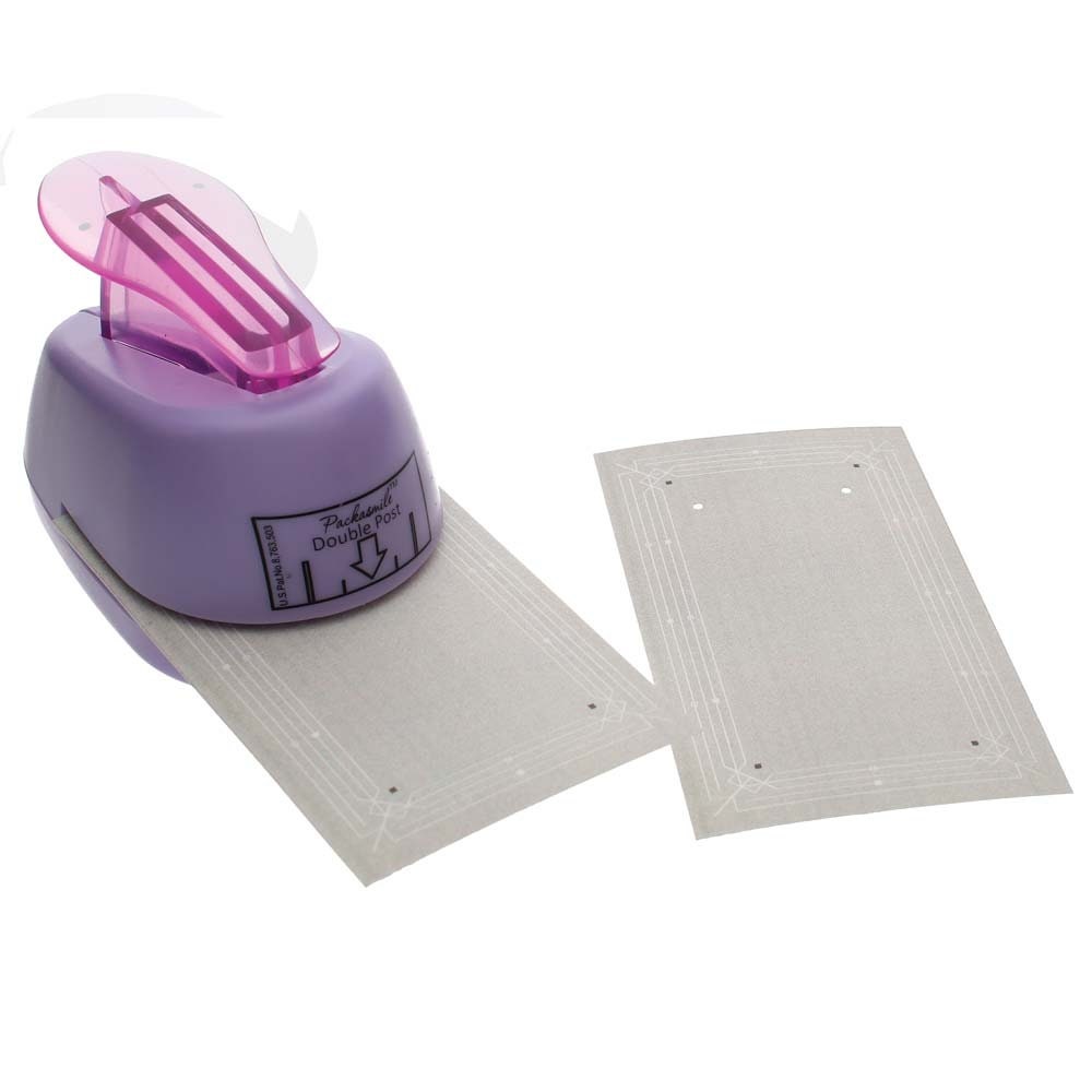 Purple paper punch with two white paper punches on a white background