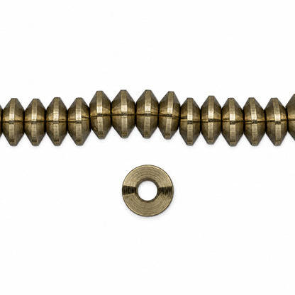 A strand of small metallic gold faceted beads with a matching flat metal washer, shown on a plain white background.