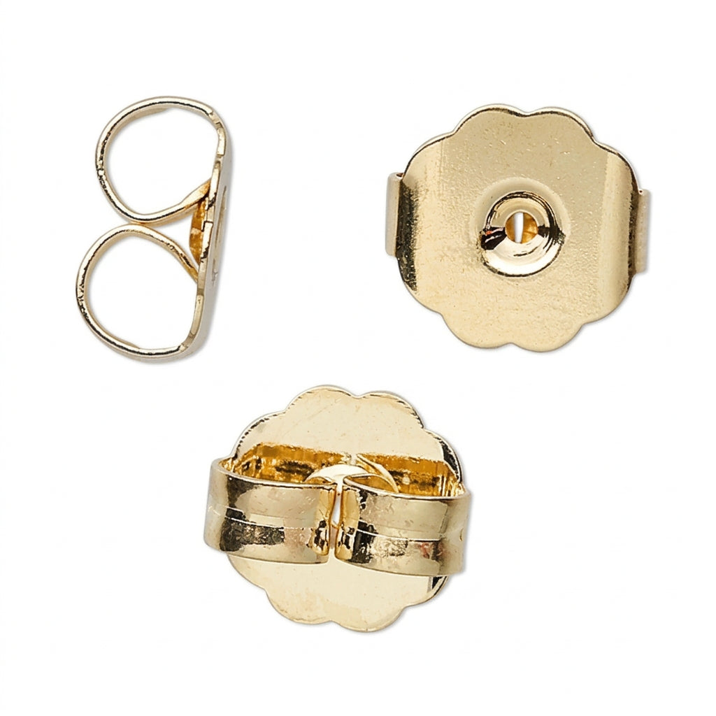 Gold earring components on a white background