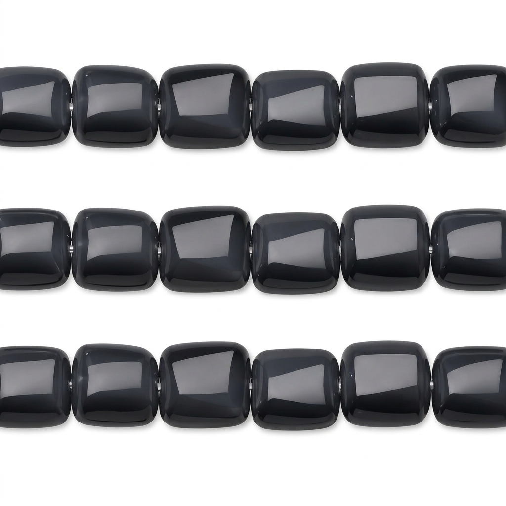 Three horizontal strands of glossy black rectangular beads with rounded corners, arranged on a plain white background.